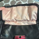 Coach Black Crossbody Bag with Adjustable Strap and Flap Closure Photo 2