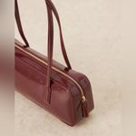 ASOS - burgundy patent faux leather elongated shoulder bag Photo 5