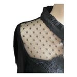 Iris NWT- Gorgeous black button front blouse, lace front, black polka dot sheer neckline, ties at neck, 100% polyester, long sleeves, brand new Measurements: Bust: armpit to armpit 20 inches Length: shoulder seam to bottom 25 inches Photo 1