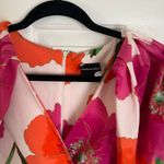Anthropologie floral pink and orange bold print midi wrap dress Photo 1