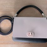 Good condition o pocket with 2 interchangeable flaps and handle. Black Photo 0