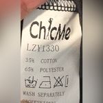 Chic Black Jumpsuit with Gold Accents NWOT Size L Photo 4