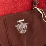 SKIMS  fits everybody lace triangle onesie in oxblood L Photo 10