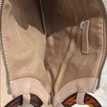 Elegant Tan Clutch with Tortoise Shell Accent Photo 3