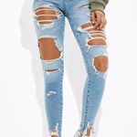 American Eagle blue lightwash ripped skinny jeans! Photo 0