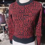 Michael Kors NWT  MK Print Logo Sweater Crew Neck Knit Black Red Size XS $110  New with tag  Same day shipping  Smoke and pets free  Elevate your wardrobe with this stunning  sweater featuring the iconic MK print logo in black and red. The crew neck and long sleeves provide a classic silhouette while the knit fabric type makes it lightweight and breathable. Perfect for any occasion, this sweater comes in size XS and is a regular fit. The accents of the logo add a touch of elegance to the overall look. Ideal for women who love colorful themes, this sweater is a must-have in your closet. Photo 0