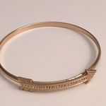 5 FOR $25 Set of 4 gold arrow bangles. Photo 1