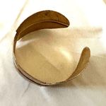 Gold tone feather cuff bracelet Photo 3