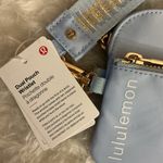 Lululemon  athletica Light Blue Wristlet with Gold Accents Photo 1
