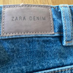 ZARA denim mini skirt, size 11/12. It is slightly distressed with a raw hem. Photo 5