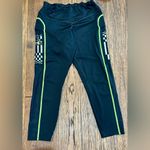 Under Armour Women’s  leggings - size XL - black w/neon green stitching - pockets Photo 5