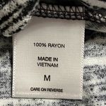 NY&C women’s size medium tank shark bite hem split sides black and white design Photo 7