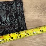 Lululemon Wunder Train High Rise Tight 25” in Logo Flourish Black Foil Photo 6