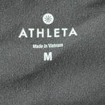 Athleta  Power Up Capri Leggings Yoga Pants Split Back Hem in Black Womens Size M Photo 4