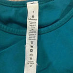 Lululemon ebb to train sports bra in the color laguna. In size 6 Photo 4