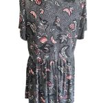 Torrid -WOMENS BABYDOLL TOP-SIZE 1X Black with pink and white flowers, has stretch, buttons down the front, short sleeves, 95% rayon 5% spandex, excellent condition Measurements: Bust: armpit to armpit 24 inches Length: shoulder seam to bottom Front: 29 inches Back: 32 inches Photo 4