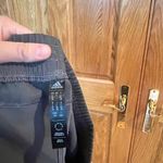 Adidas  - Women's Black Athletic Shorts with White Stripes Photo 1