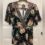 Trixxi Black and Pink Floral patterned short sleeve romper Photo 1