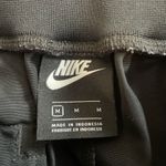 Nike  Sportwear Icon Clash Pants in Black Zippered Leg Pocket Detail Size M Photo 12