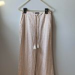 Majorelle  Theo gingham check print tan and cream wide leg pants w/ tassel detail Photo 1