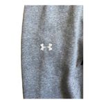 Under Armour Womens grey sweatpants, drawstring waist, logo down side of pants, excellent condition, size small Measurements: Waist: side to side 15 inches Inseam: 28 inches Photo 1