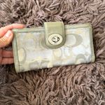Coach  Silver/Gray and tan signature Turnlock wallet with purple lining Photo 1