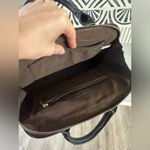 Black Handbag with Gold Accents Photo 6