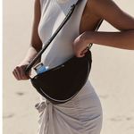 Free People  Bulls Eye Sling Bag. Color black. MSRP $40  Photo 1