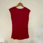 Oh Baby Maternity pink short sleeve ruched shirt with flower detail Size undefined Photo 1