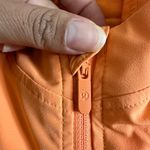 Lululemon Athletica Orange Raincoat with Hood and Water-Resistant Fabric Photo 12