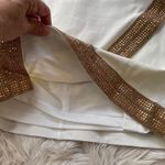 Bebe Ivory Asymmetrical Hem Gold Trim Dress Photo 5