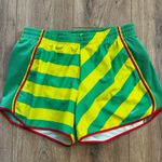 Nike  Dri-Fit Athletic Shorts Women's size Small in Green Yellow stripes running Photo 0