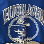 Elton John cut off T Photo 3