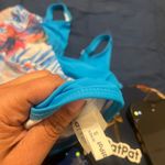 Patipati Stylish blue swimsuit dress with floral pattern. Perfect for beach days. Photo 7