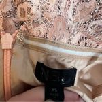 NBD  Revolve Secrets Revealed Lace
Asymmetrical Romper in Dusty Rose Sz XS Photo 6