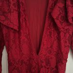 Free People jumpsuit. Red lace w/ deep V & shoulder detail. Color-red size small Photo 9