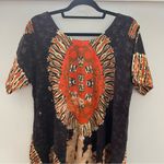 Deep Exports, featuring black background with orange and white circular patterns Size L Photo 1