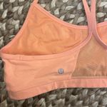 Lululemon  Neon Orange sports bra with mesh panel in back Size 12 no padding Photo 2