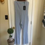 Pretty Little Thing  Light Blue Textured Flare Strapless Jumpsuit Photo 1