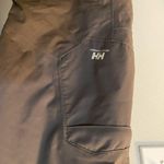 Helly Hansen  medium insulated dark grey snow pants. Adjustable waist and pockets Photo 1