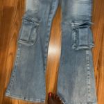 Insane Gene size 9 stretchy jeans. 5 front cargo pockets. Flares. 31 inch inseam Photo 1