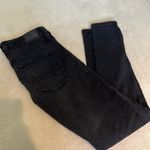 American Eagle  Next Level Highest Waist Jeggings in Black. Photo 1