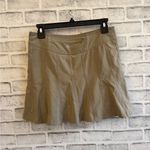 Athleta Women’s  Athletic skort, skirt with shorts tan pleated, Size 2 Photo 1