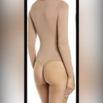 SKIMS  Essential Crew Neck Longsleeve Thong Bodysuit Photo 1