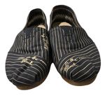Toms  slipons in navy blue and tan stripes with “Love Is the New Black” quote Photo 7