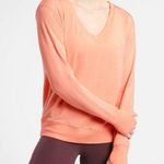Athleta NWT  Sunrise V neck Sweatshirt Medium peachy orange color thumb holes Photo 0