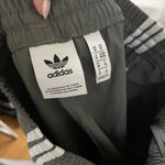 Adidas  gray tapered windbreaker jogger pants size US medium Photo 4