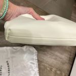 Understated Leather Cream Crescent Clutch Textured Wristlet Photo 5