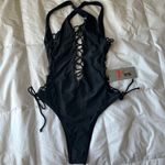 Black one piece with open sides Photo 1