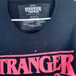 Stranger Things  Graphic Black And Pink Sweater Photo 1